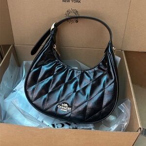 Coach black crescent-shaped underarm bag